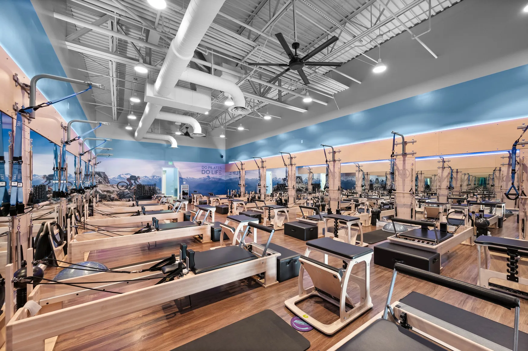 Finished commercial fitness-studio interior with blue wall finishes